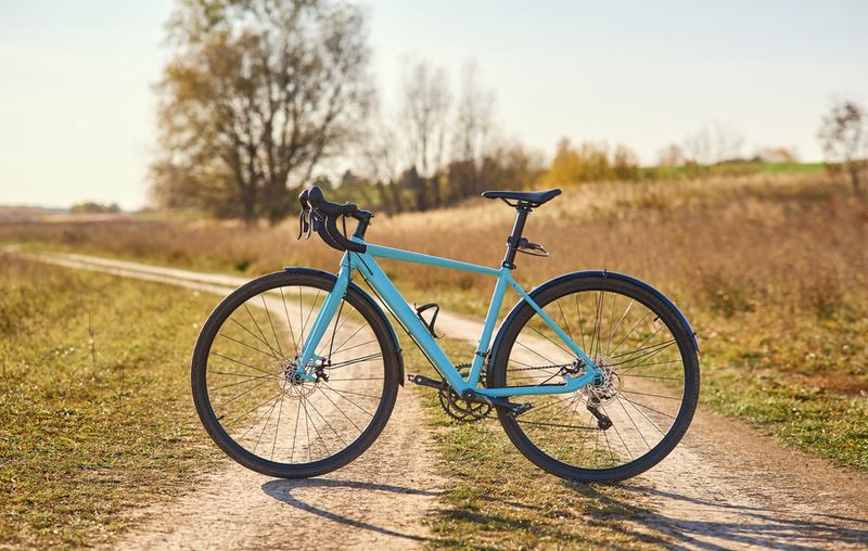 budget endurance blue road bike on the road